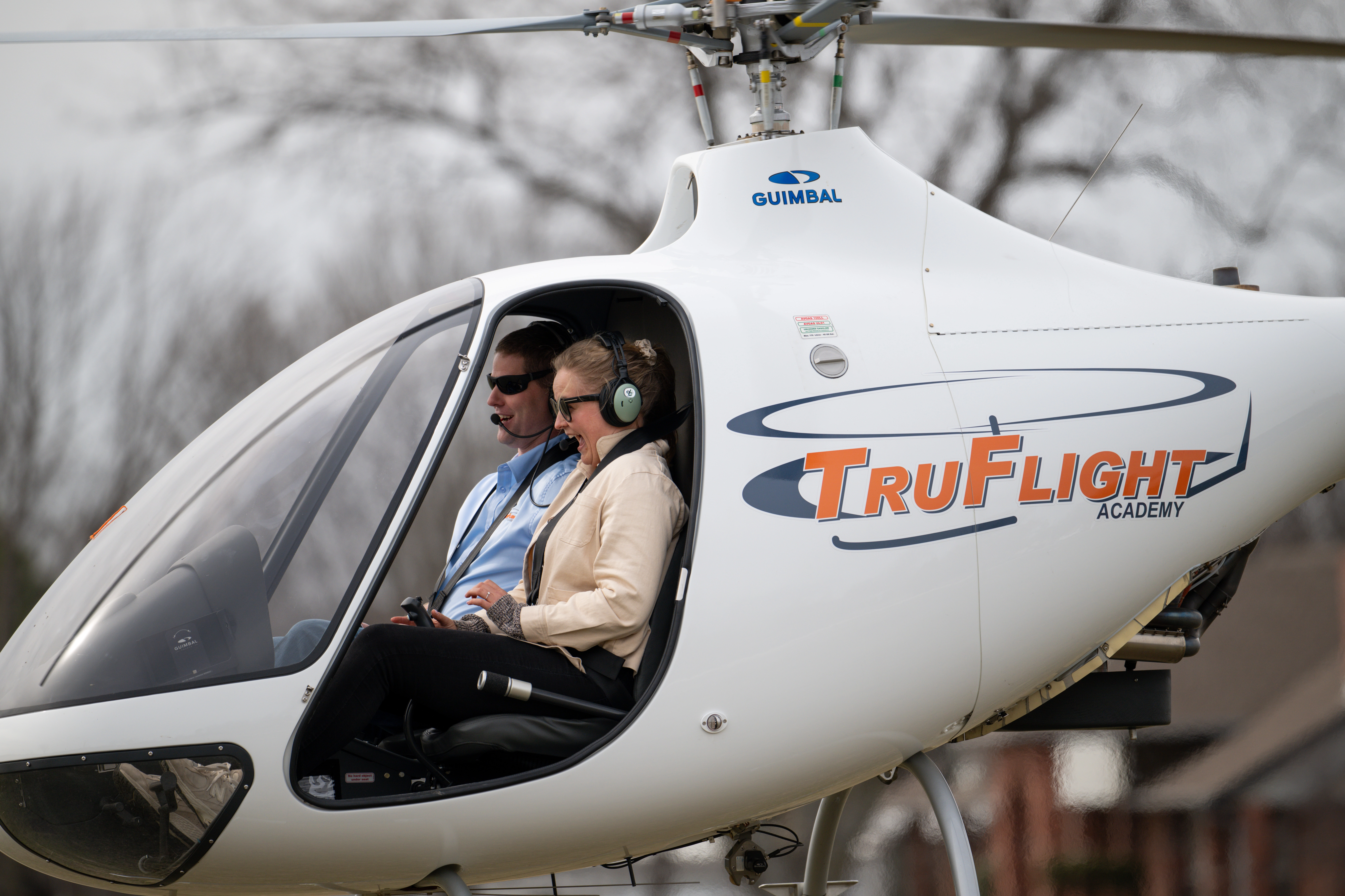 Excited pilot in helicopter seen from the left