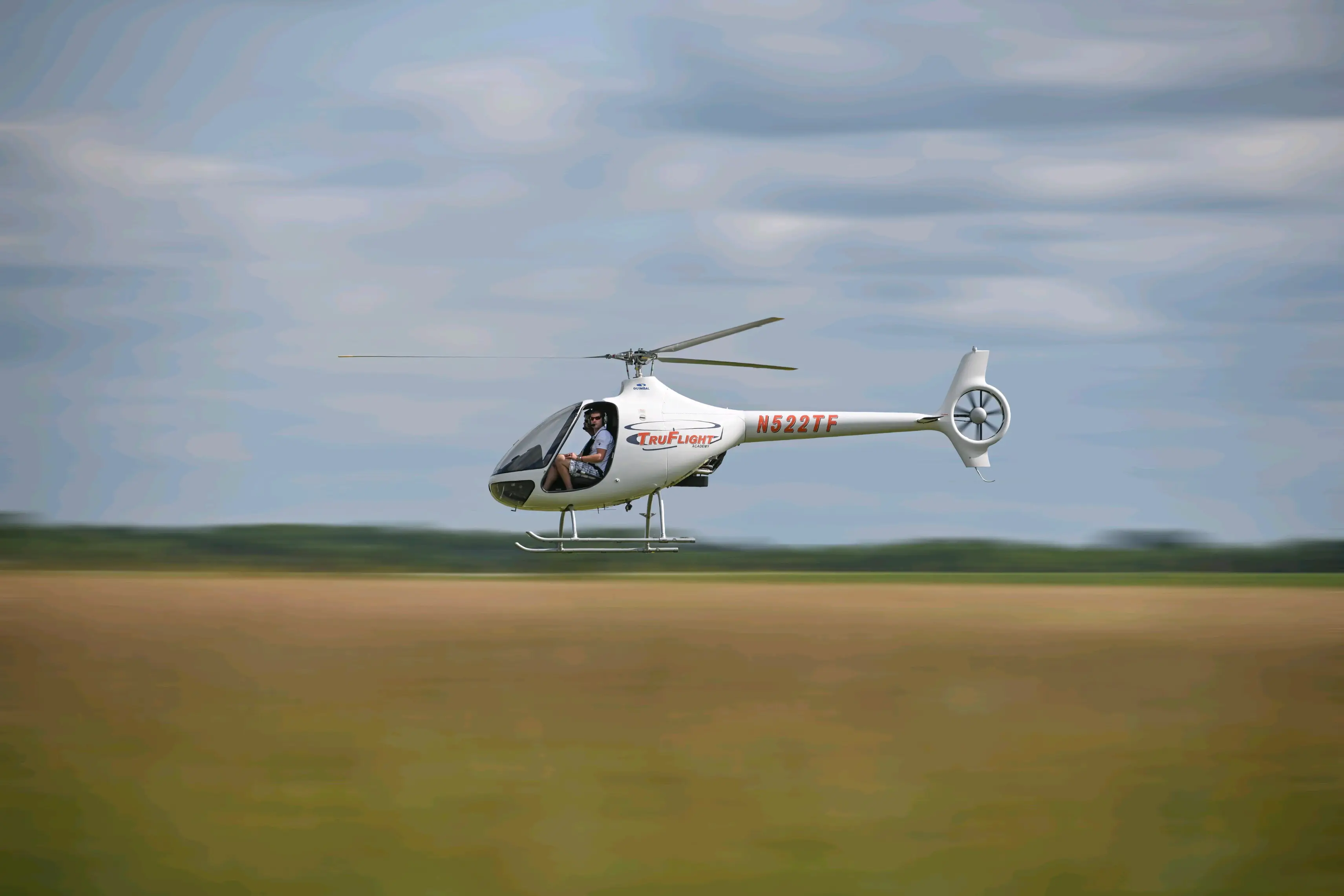 Helicopter flying with motion blur around it