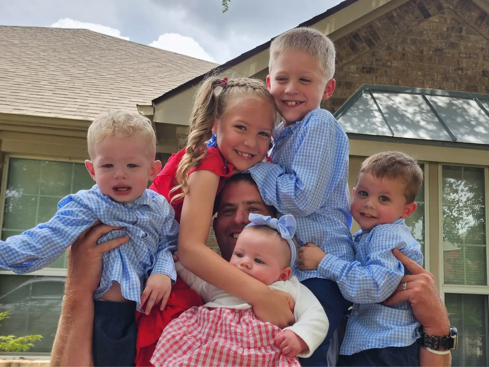 Todd Guison, TruFlight's chief pilot, with his children on his shoulders